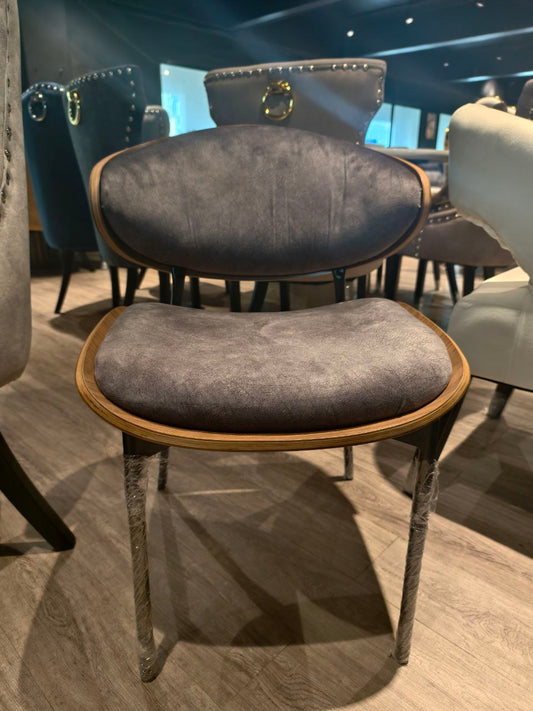 Gray upholstered chair with wooden frame