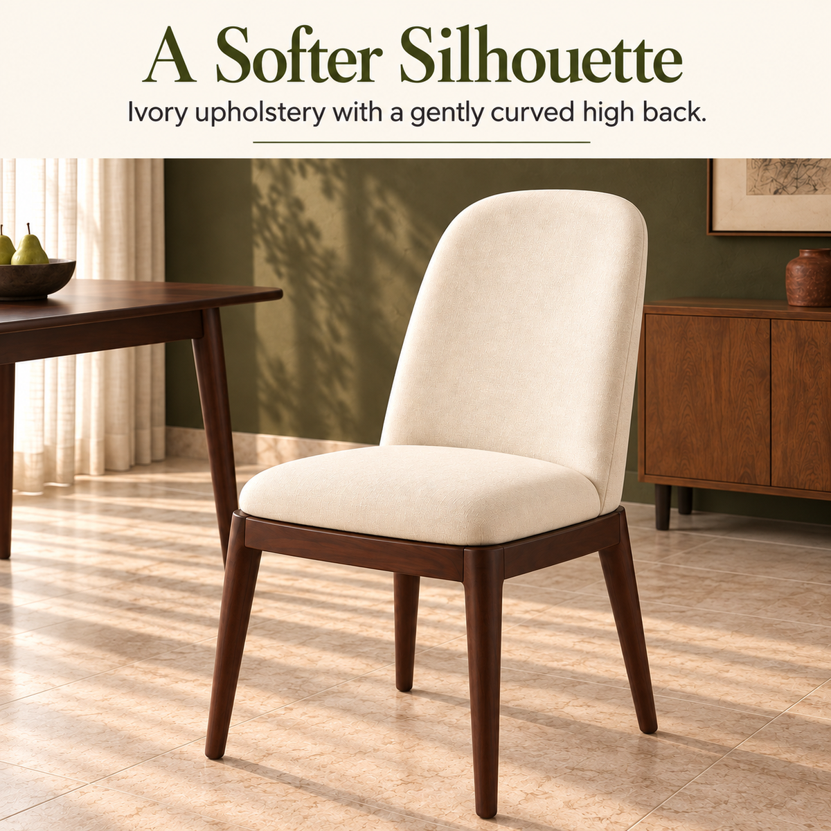 Three-quarter view of an ivory Arden dining chair with tapered legs