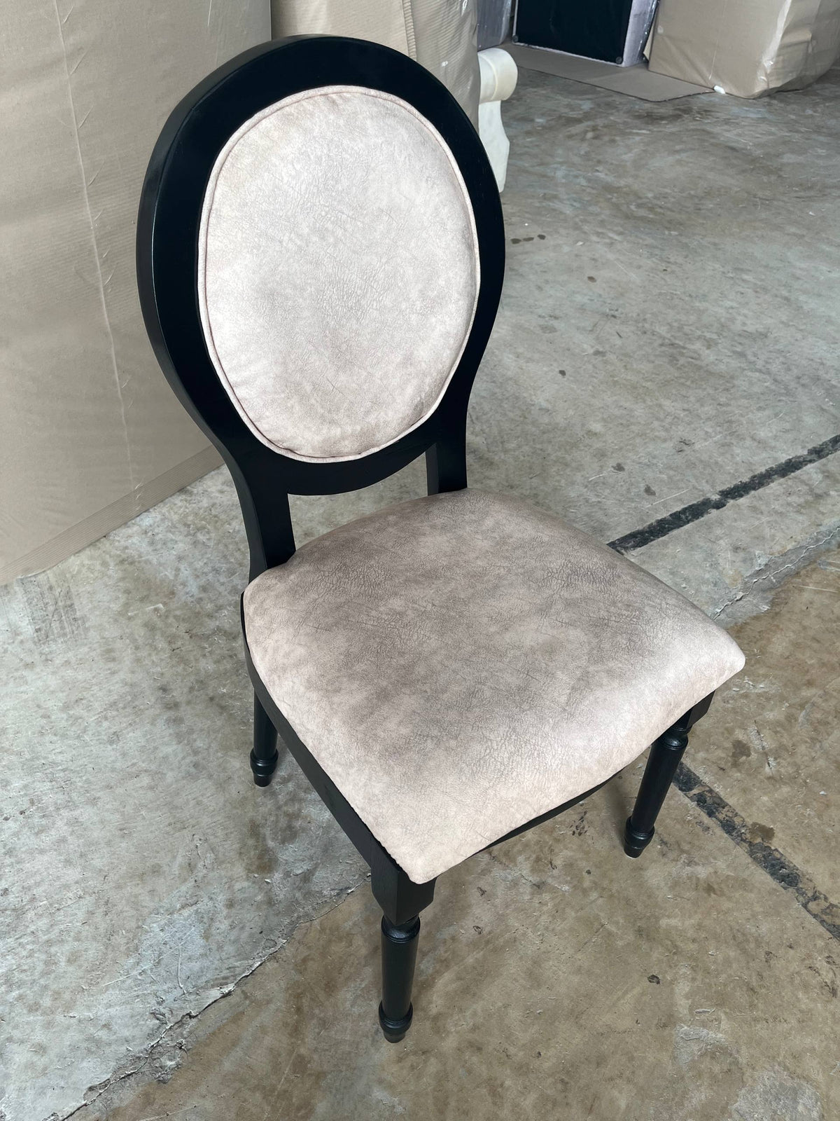 Overhead angled view of a cream Roma chair showing the oval back and padded seat